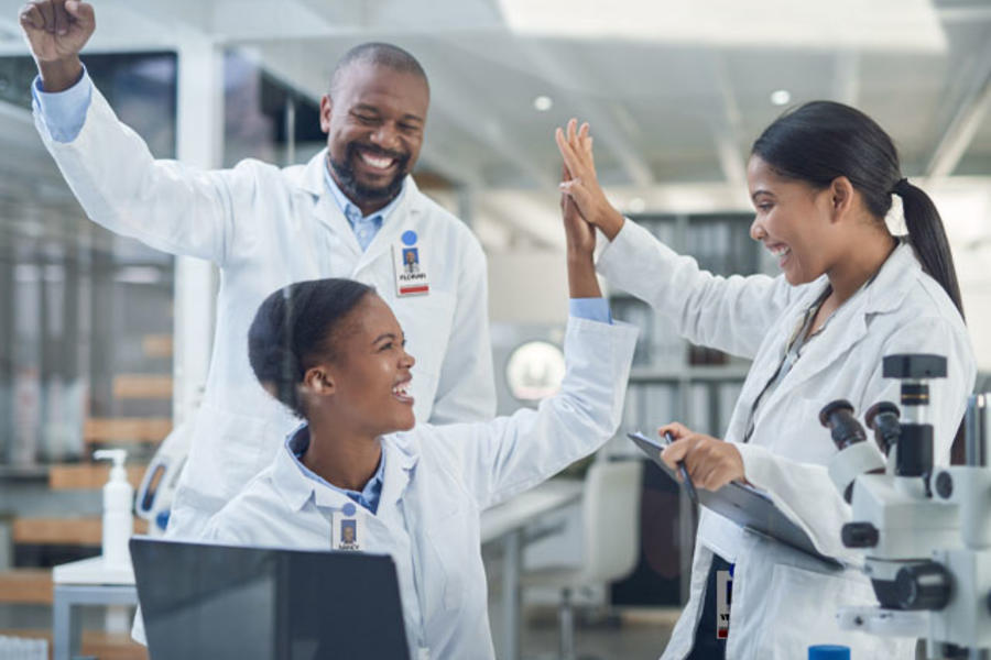 Three students interacting in a clinical health setting